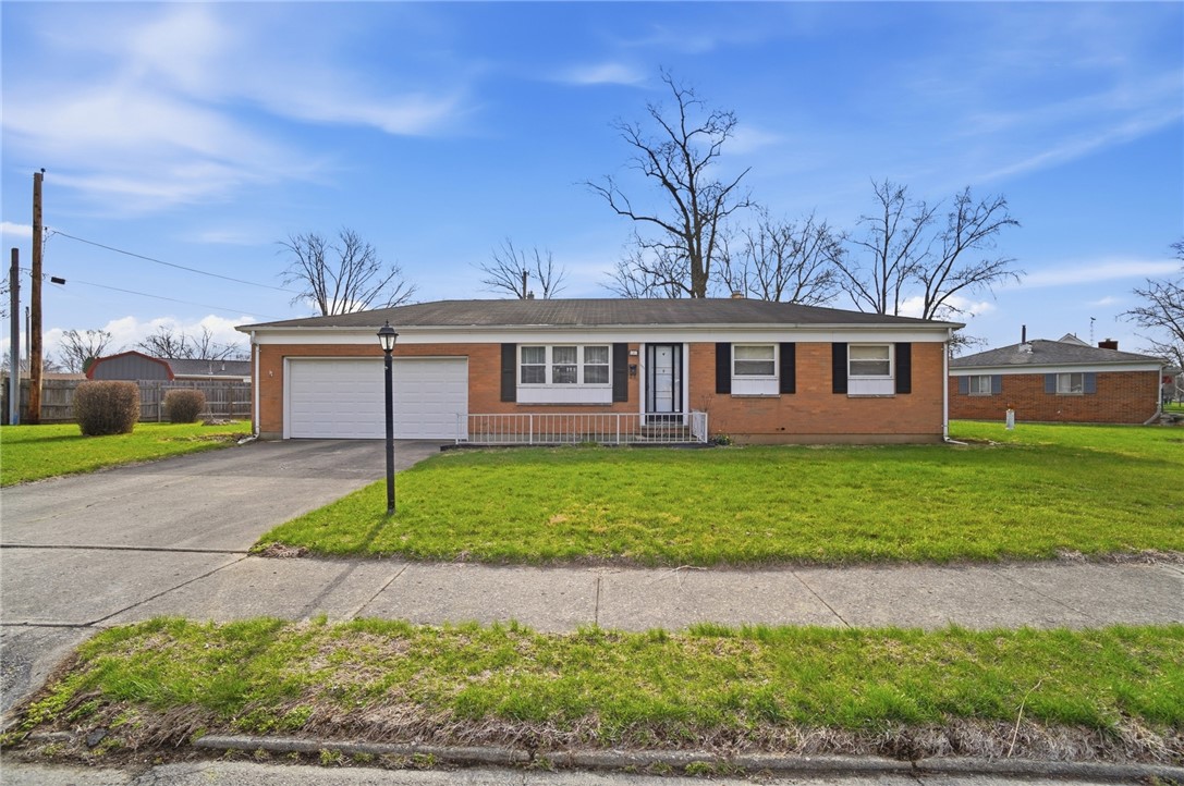 1087 Fairfield Road Troy, OH 45373 - Photo 1 of 39 This classic brick residence features a lush lawn and a welcoming entryway.