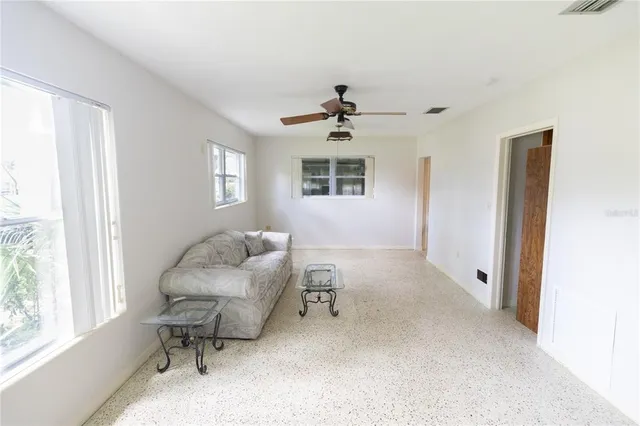 a living room with furniture and a window