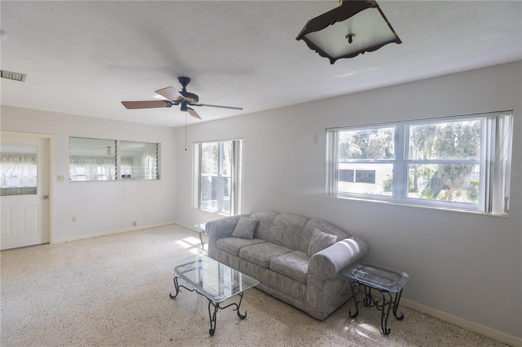 1010 Glen Ridge Drive Leesburg, FL 34748 - Photo 7 of 24 a living room with furniture and a window