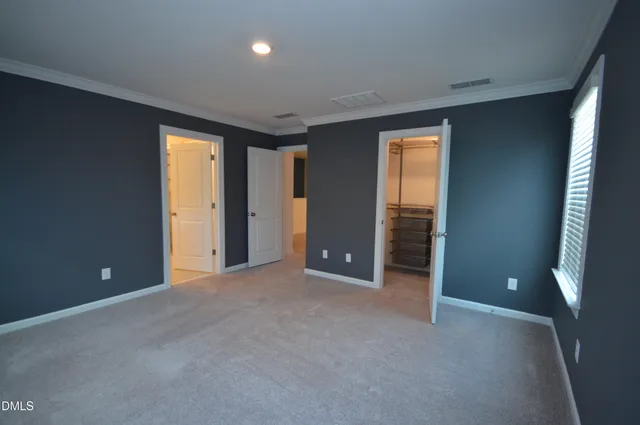 a view of hallway with stairs and a closet