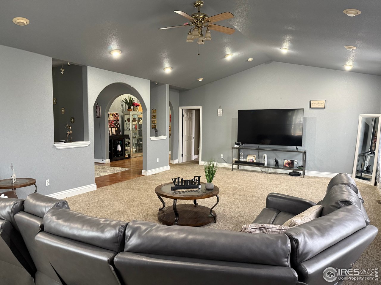 419 East 3rd Avenue Wiggins, CO 80654 - Photo 1 of 20 a living room with furniture and a flat screen tv