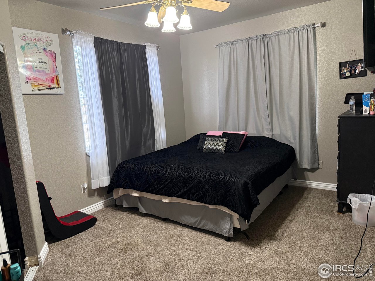 419 East 3rd Avenue Wiggins, CO 80654 - Photo 13 of 20 a bedroom with a bed and a window