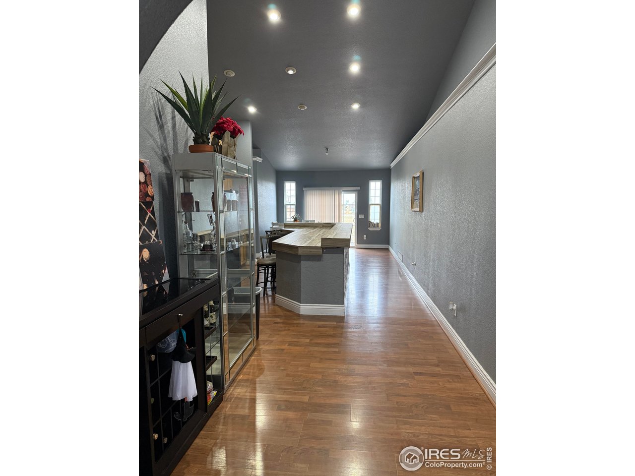 419 East 3rd Avenue Wiggins, CO 80654 - Photo 5 of 20 a lobby with furniture and potted plants