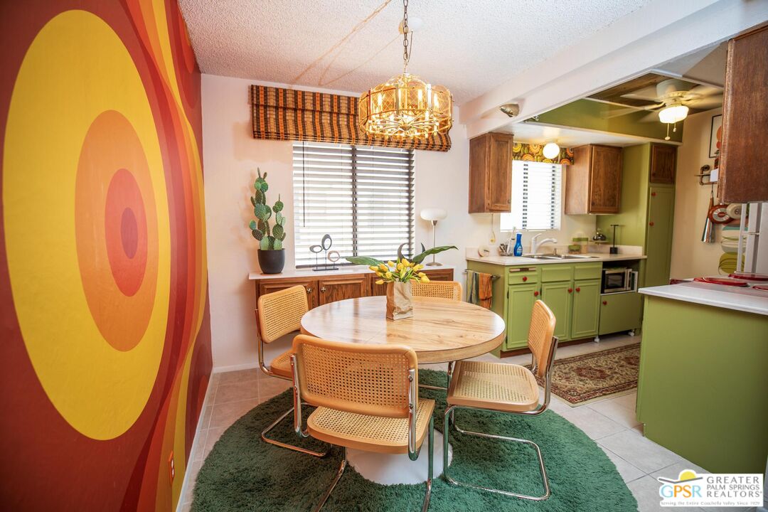 1050 Ramon Road, Unit 34 Palm Springs, CA 92264 - Photo 4 of 10 a bathroom with a sink mirror and a window