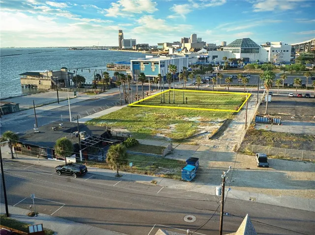 a view of a swimming pool with a table and chairs