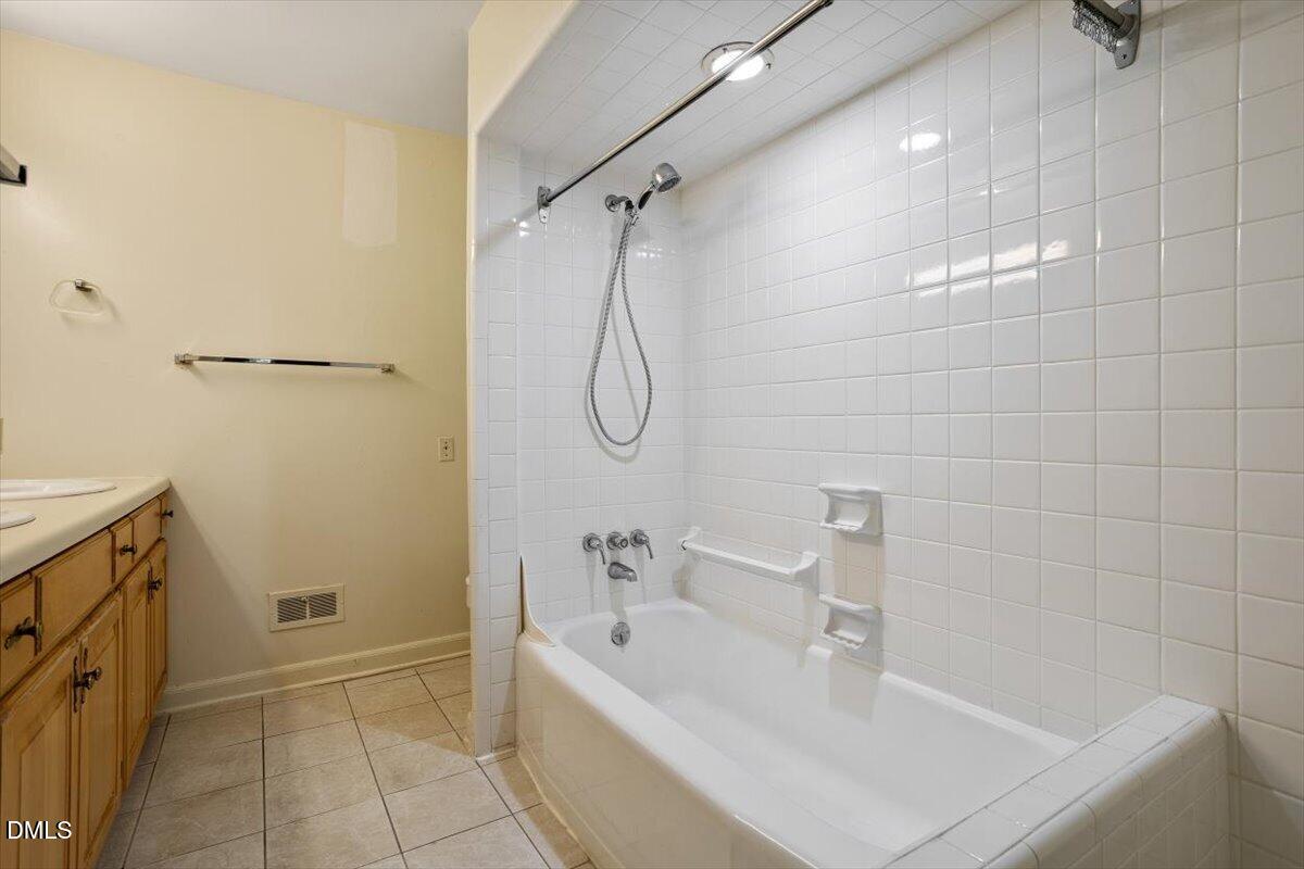 904 Kings Mill Road Chapel Hill, NC 27517 - Photo 12 of 33 a bathroom with a tub a sink and a shower