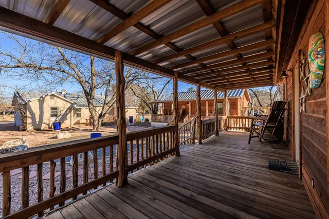 a living room with furniture a fireplace and a table