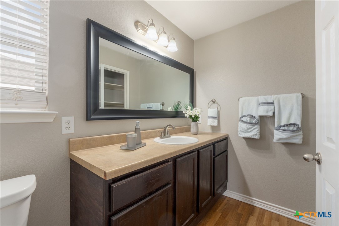 916 Freedom Drive Temple, TX 76502 - Photo 16 of 24 a bathroom with a sink and a mirror