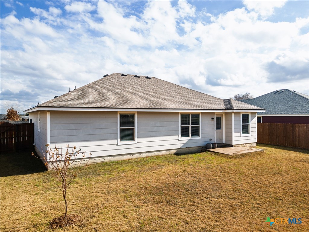 916 Freedom Drive Temple, TX 76502 - Photo 21 of 24 a front view of a house with yard