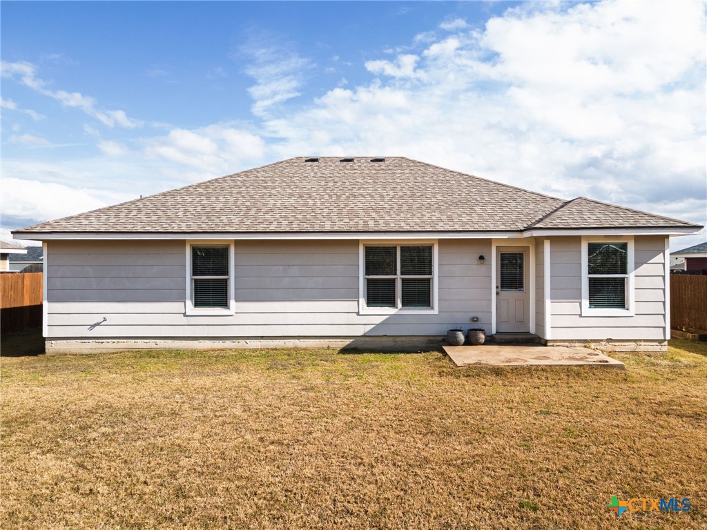 916 Freedom Drive Temple, TX 76502 - Photo 22 of 24 a front view of a house with a yard