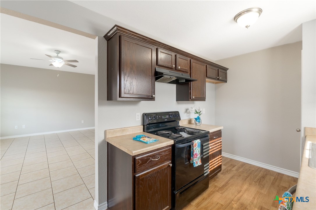 916 Freedom Drive Temple, TX 76502 - Photo 9 of 24 a kitchen with a stove and a microwave