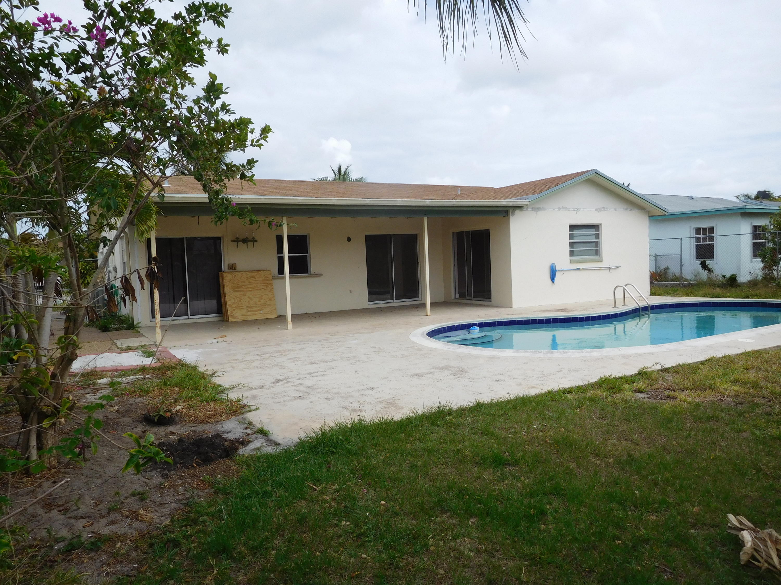 22367 Southwest 65th Avenue Boca Raton, FL 33428 - Photo 12 of 13 a view of a house with a backyard
