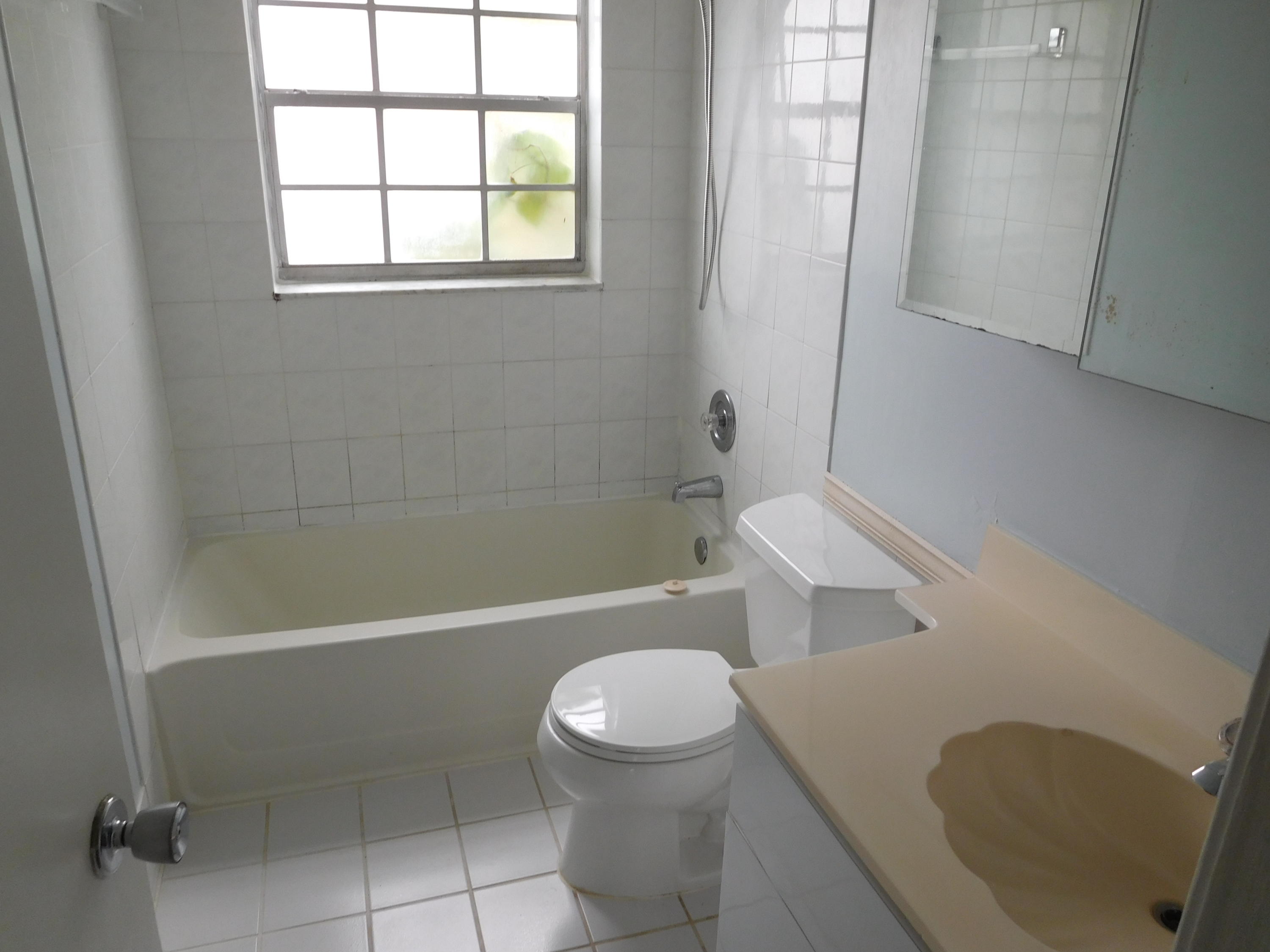 22367 Southwest 65th Avenue Boca Raton, FL 33428 - Photo 13 of 13 a bathroom with a toilet and a bathtub