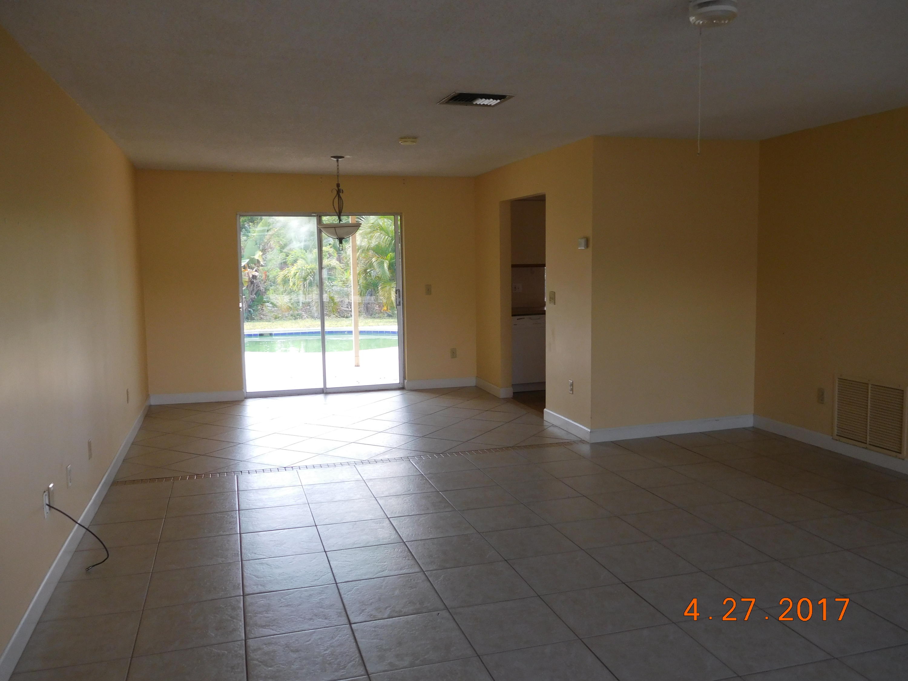 22367 Southwest 65th Avenue Boca Raton, FL 33428 - Photo 3 of 13 a view of an empty room with a window