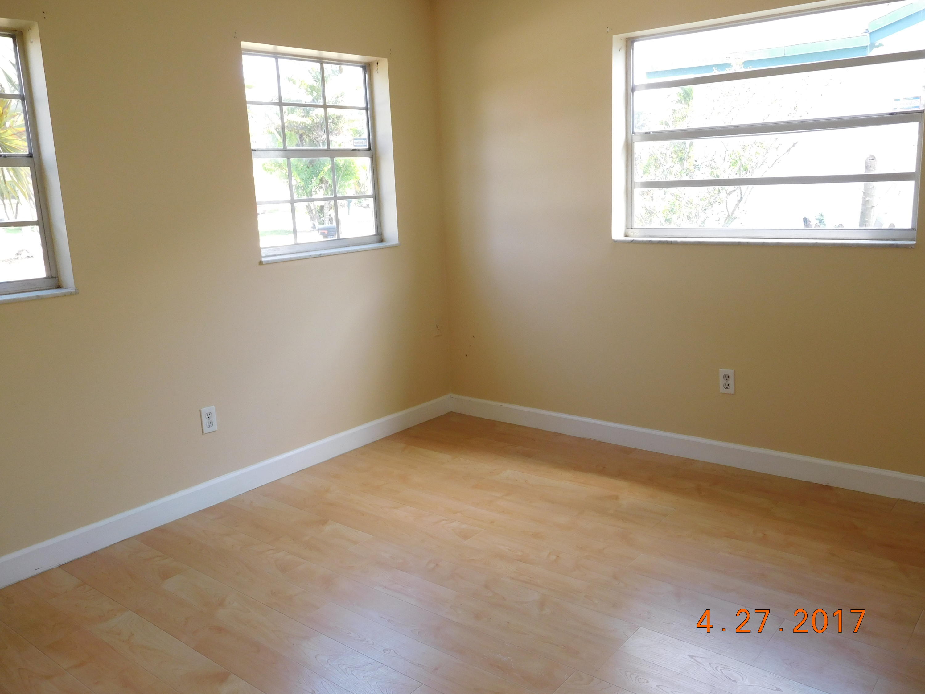 22367 Southwest 65th Avenue Boca Raton, FL 33428 - Photo 4 of 13 an empty room with a window