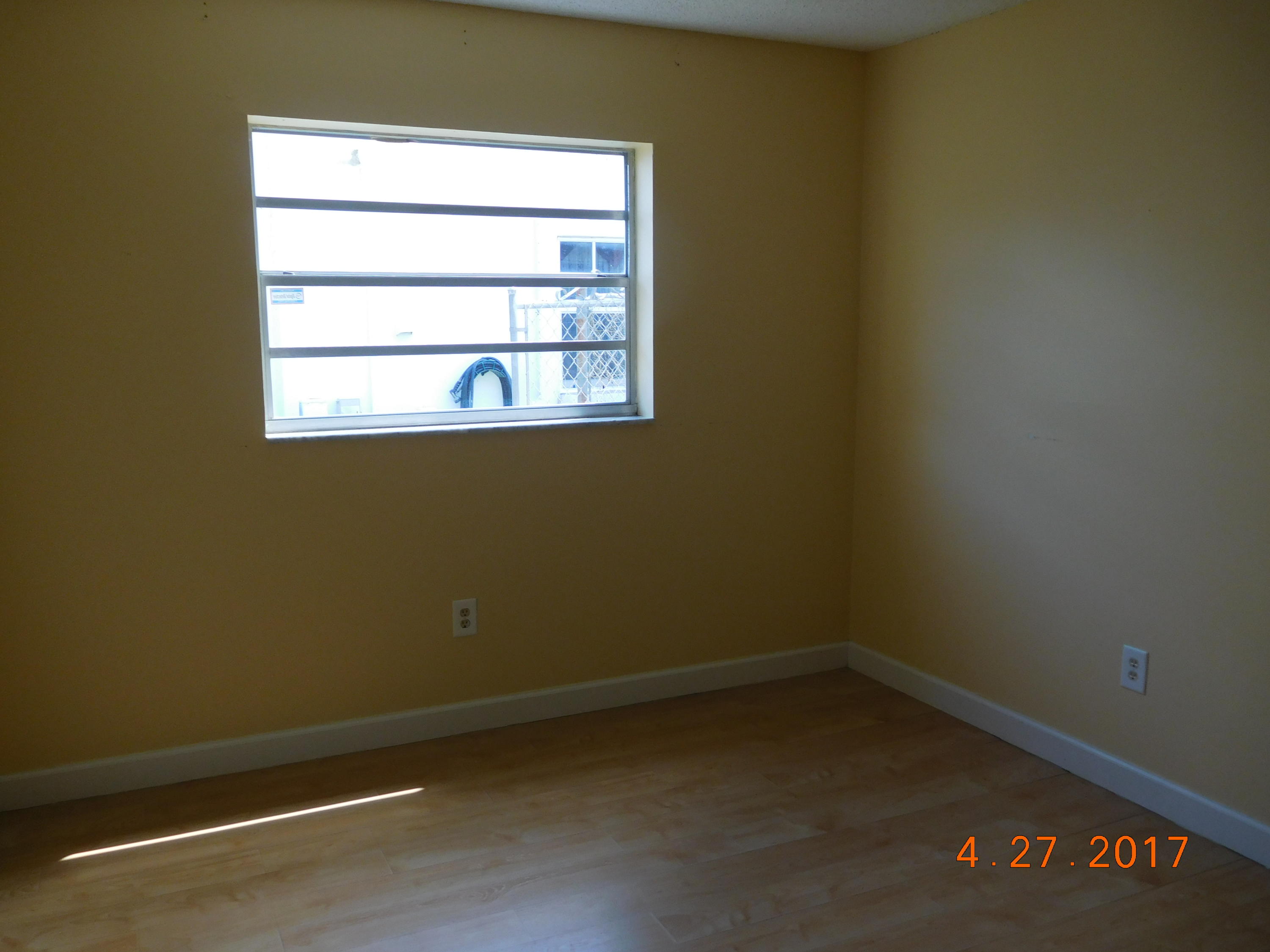 22367 Southwest 65th Avenue Boca Raton, FL 33428 - Photo 5 of 13 an empty room with a window