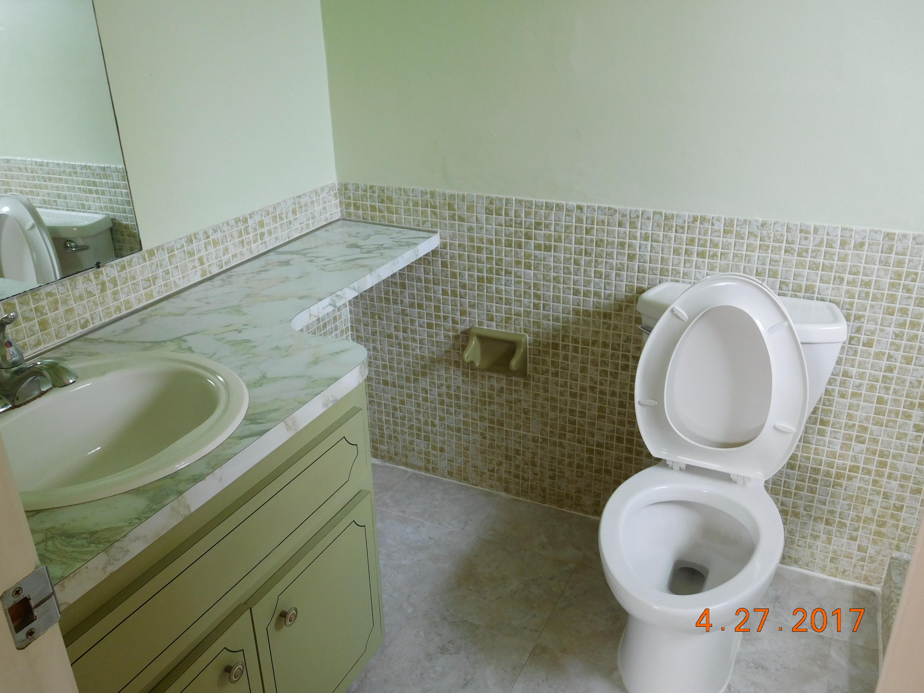 22367 Southwest 65th Avenue Boca Raton, FL 33428 - Photo 9 of 13 a bathroom with a sink and a mirror