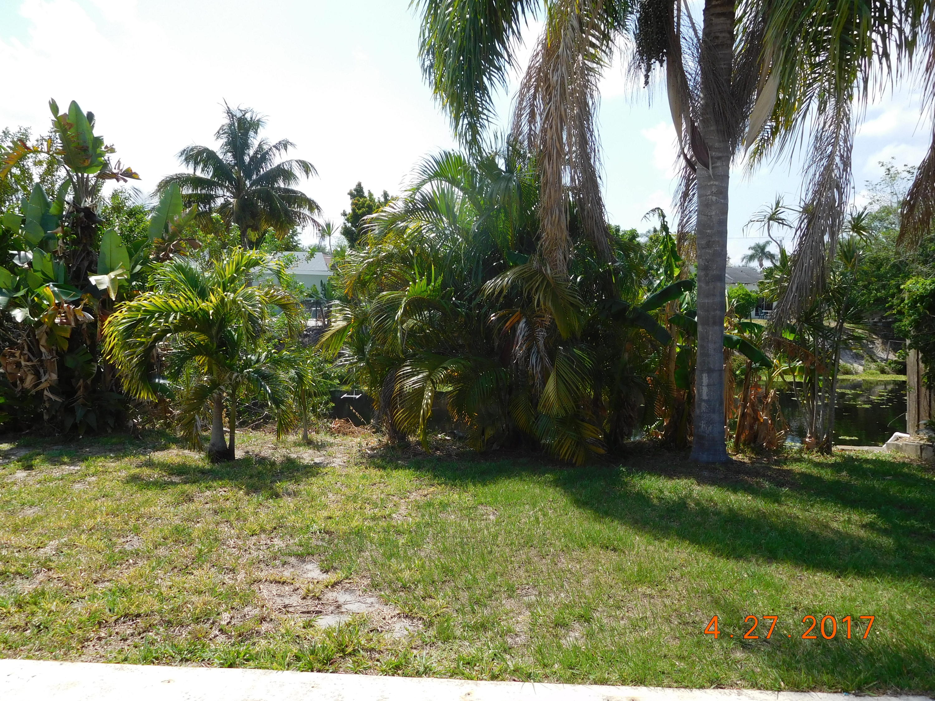 22367 Southwest 65th Avenue Boca Raton, FL 33428 - Photo 10 of 13 a backyard of a house with lots of green space