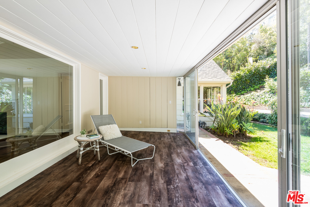 10886 Chalon Road Los Angeles, CA 90077 - Photo 14 of 33 a living room with a couch and a table