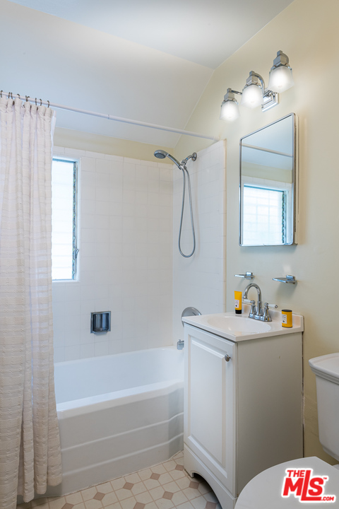 10886 Chalon Road Los Angeles, CA 90077 - Photo 22 of 33 a bathroom with a sink a toilet and shower