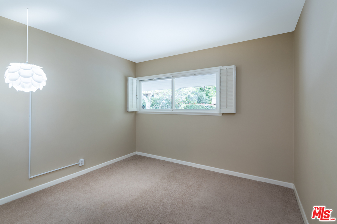 10886 Chalon Road Los Angeles, CA 90077 - Photo 24 of 33 an empty room with a window