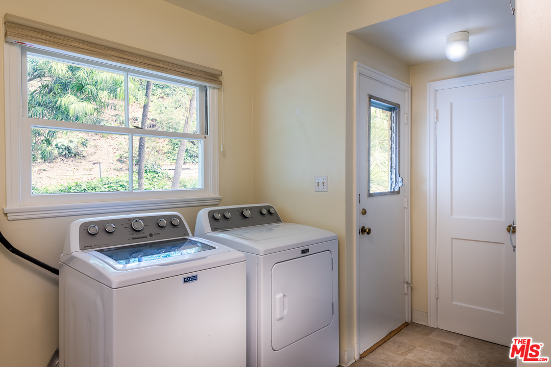 10886 Chalon Road Los Angeles, CA 90077 - Photo 25 of 33 a utility room with dryer and washer