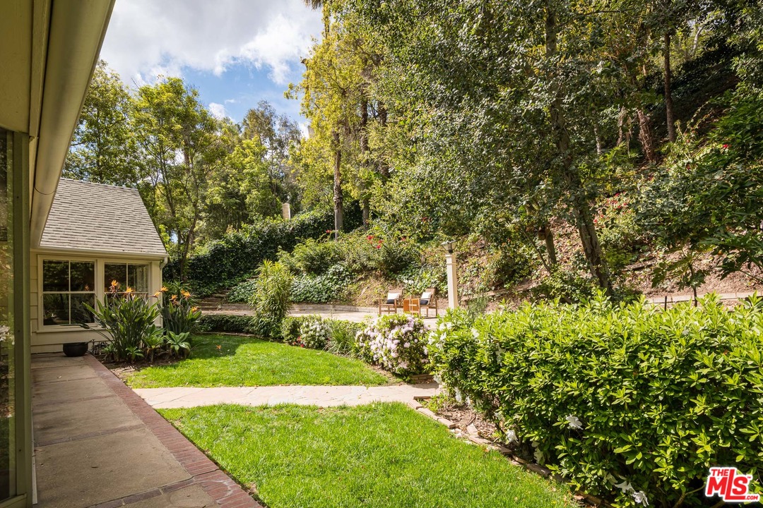 10886 Chalon Road Los Angeles, CA 90077 - Photo 27 of 33 a view of backyard of house with green space