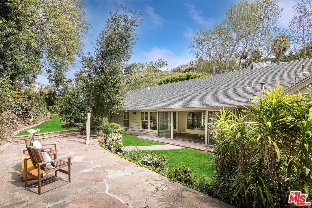 10886 Chalon Road Los Angeles, CA 90077 - Photo 4 of 33 a house view with a garden space