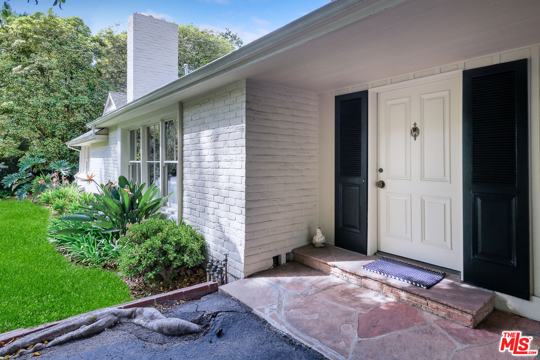 10886 Chalon Road Los Angeles, CA 90077 - Photo 5 of 33 a view of backyard with potted plants