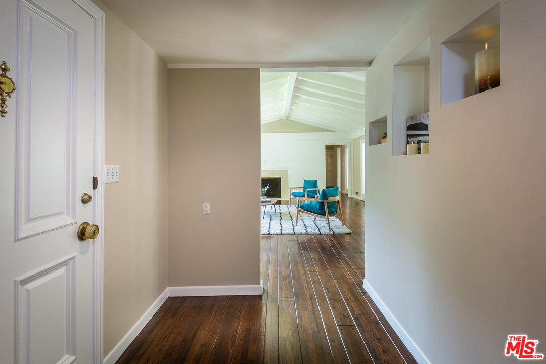 10886 Chalon Road Los Angeles, CA 90077 - Photo 6 of 33 a view of a hallway view with wooden floor