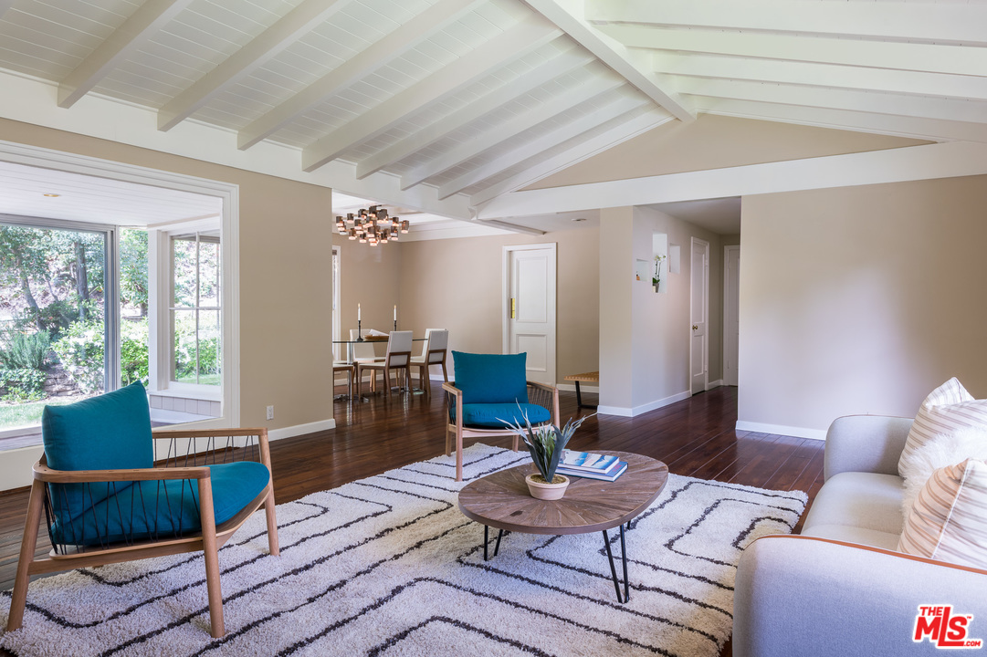 10886 Chalon Road Los Angeles, CA 90077 - Photo 8 of 33 a living room with furniture and wooden floor