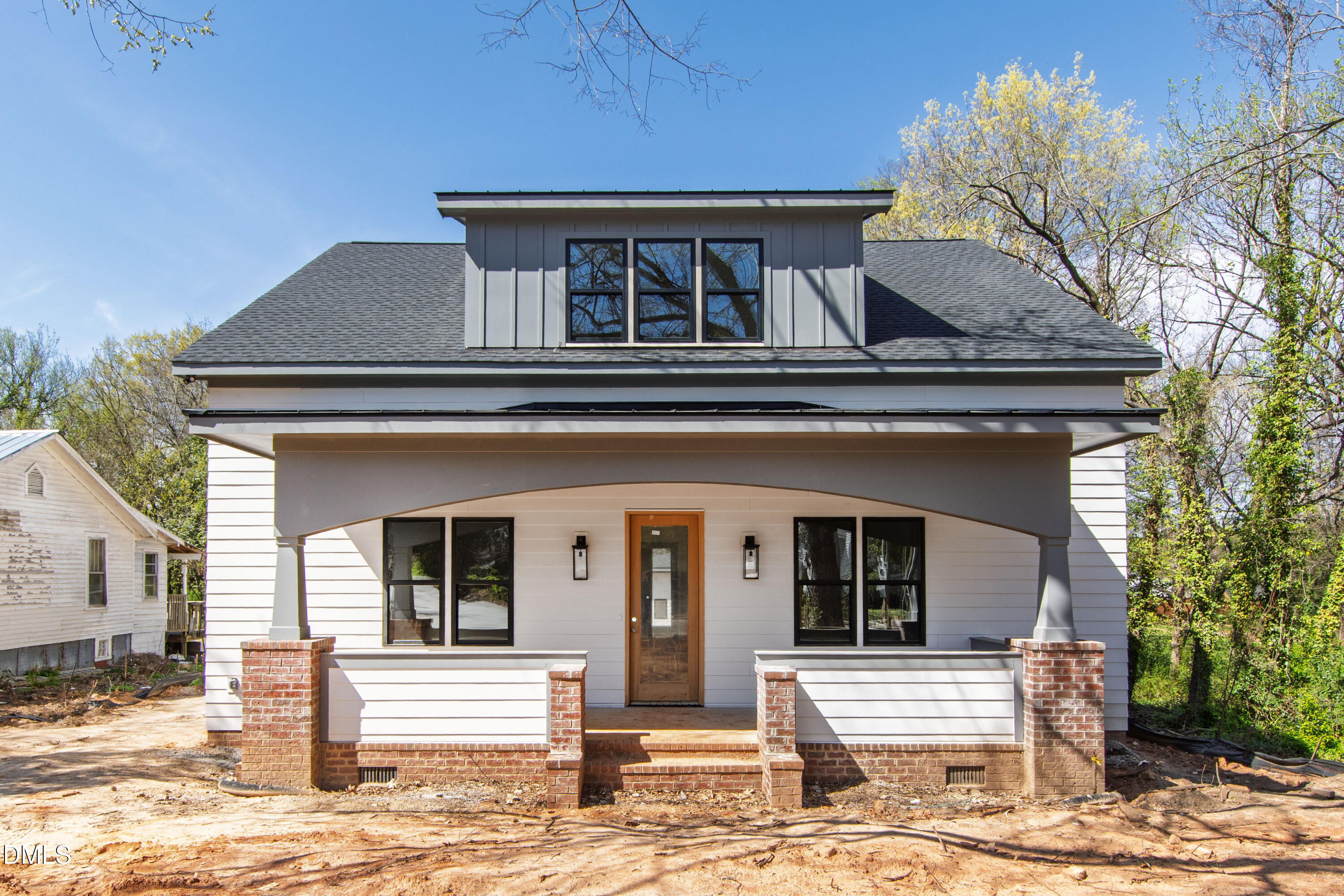 909 Oberlin Road Raleigh, NC 27605 - Photo 1 of 59 a front view of a house with a yard