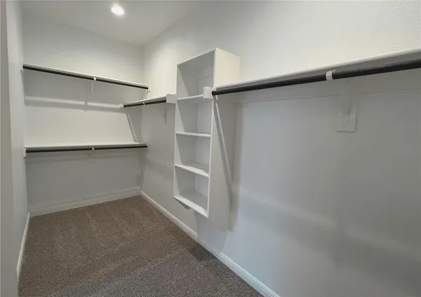 a view of an empty walk in closet