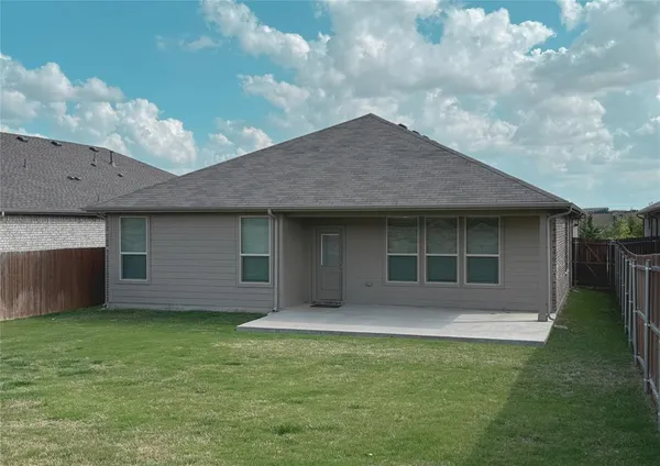 a front view of house with yard and barbeque oven