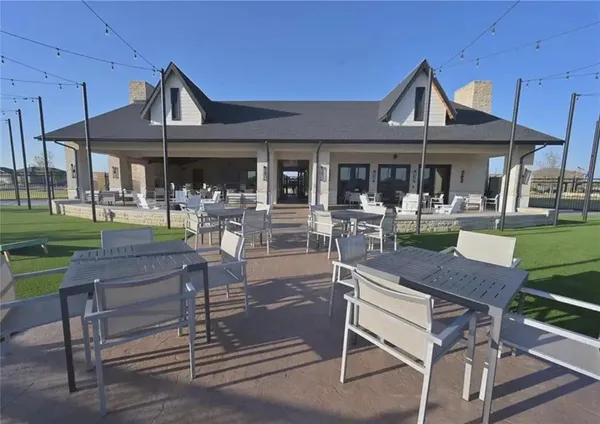 a patio with a table and chairs