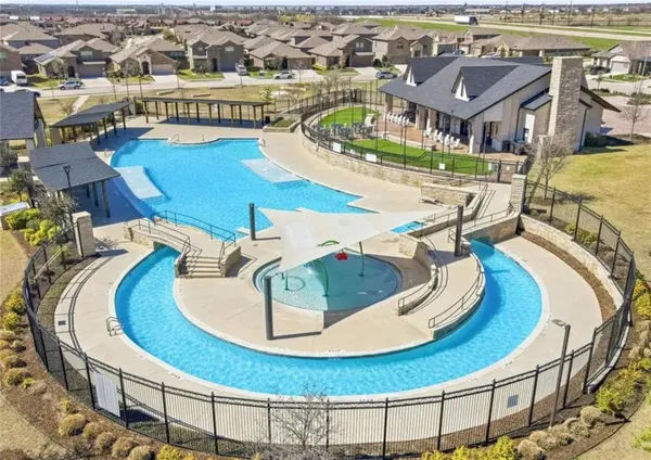 an aerial view of a house with swimming pool