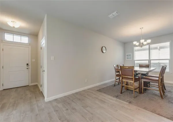 an dining room with furniture and window