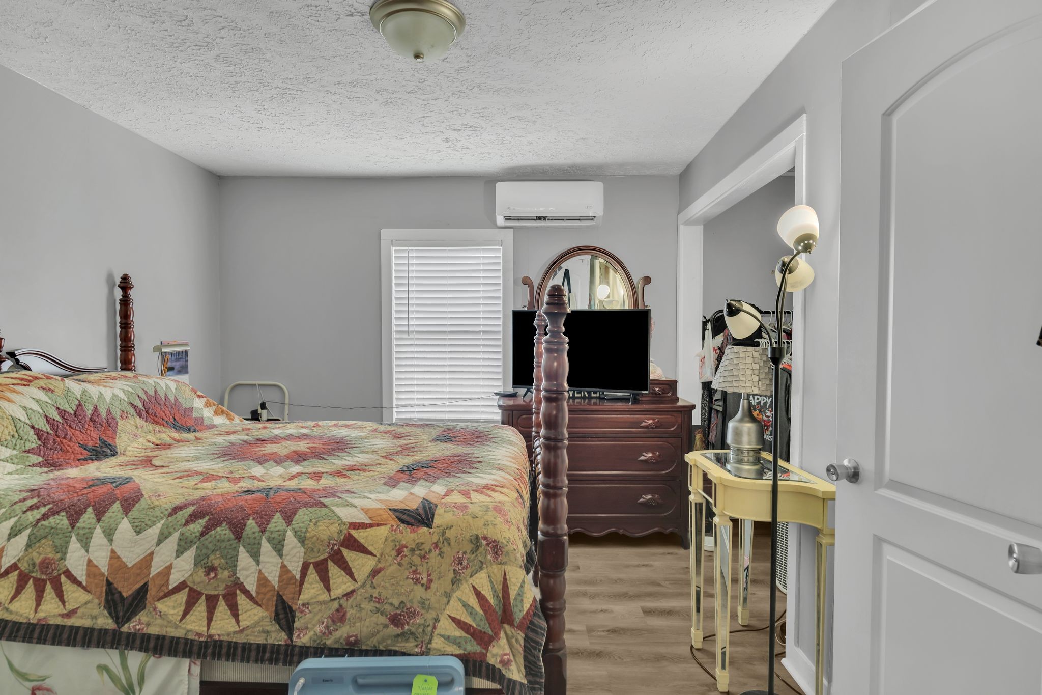 514 East 8th Avenue Springfield, TN 37172 - Photo 18 of 29 a bedroom with a bed and a flat tv screen on dresser