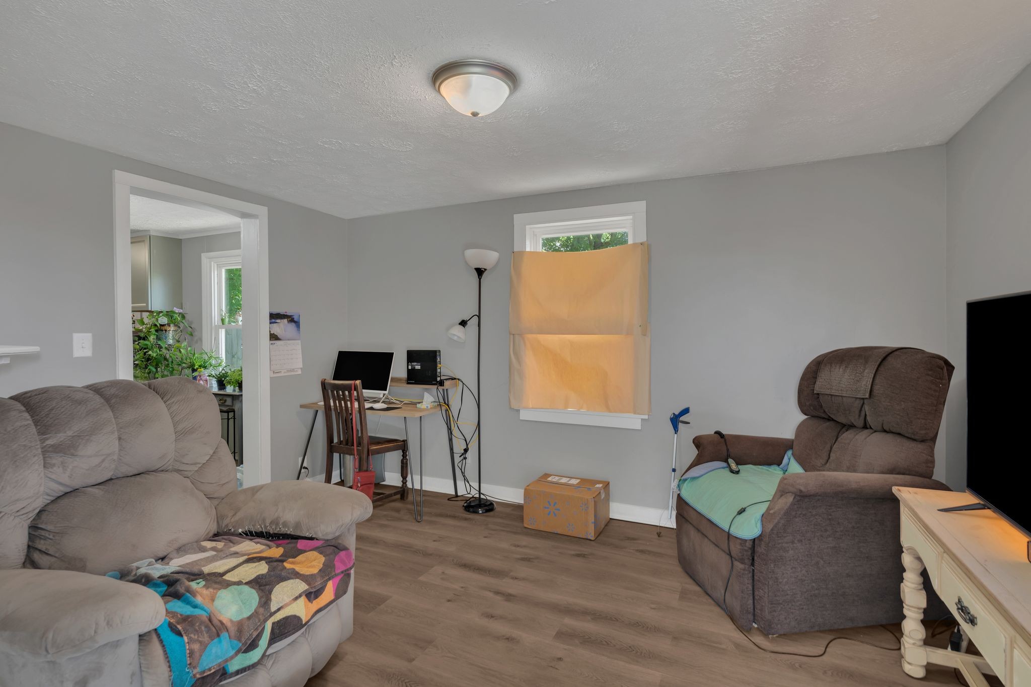 514 East 8th Avenue Springfield, TN 37172 - Photo 6 of 29 a living room with furniture and a flat screen tv