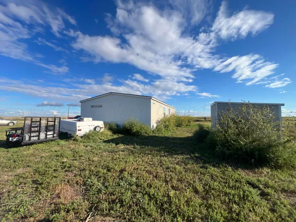 a view of an ocean and a yard