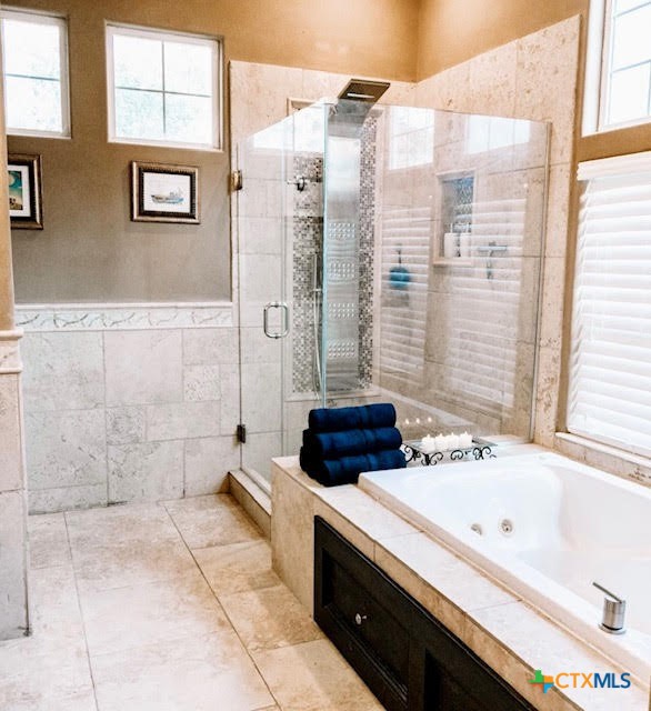 447 Schaefer Road Victoria, TX 77905 - Photo 15 of 25 a bathroom with a tub a sink and a shower