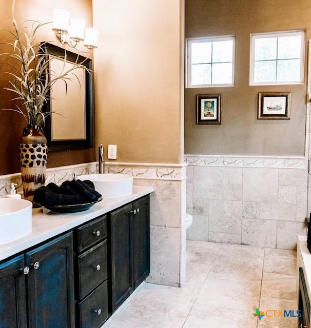 447 Schaefer Road Victoria, TX 77905 - Photo 16 of 25 a bathroom with a sink a toilet and mirror