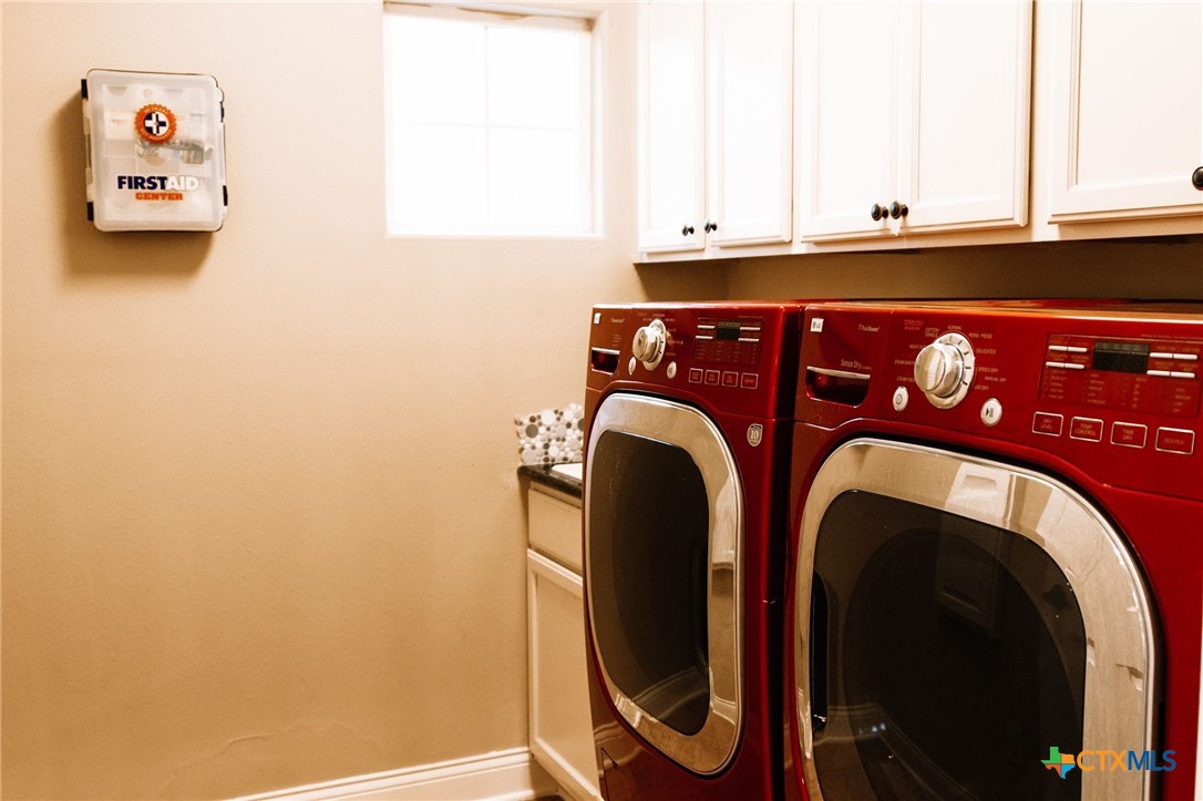 447 Schaefer Road Victoria, TX 77905 - Photo 21 of 25 a utility room with dryer and washer