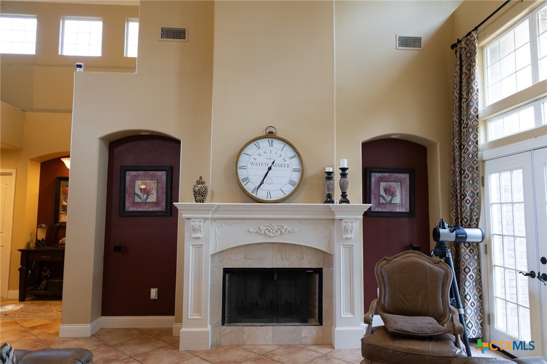 447 Schaefer Road Victoria, TX 77905 - Photo 8 of 25 a living room with a furniture a fireplace and a large window