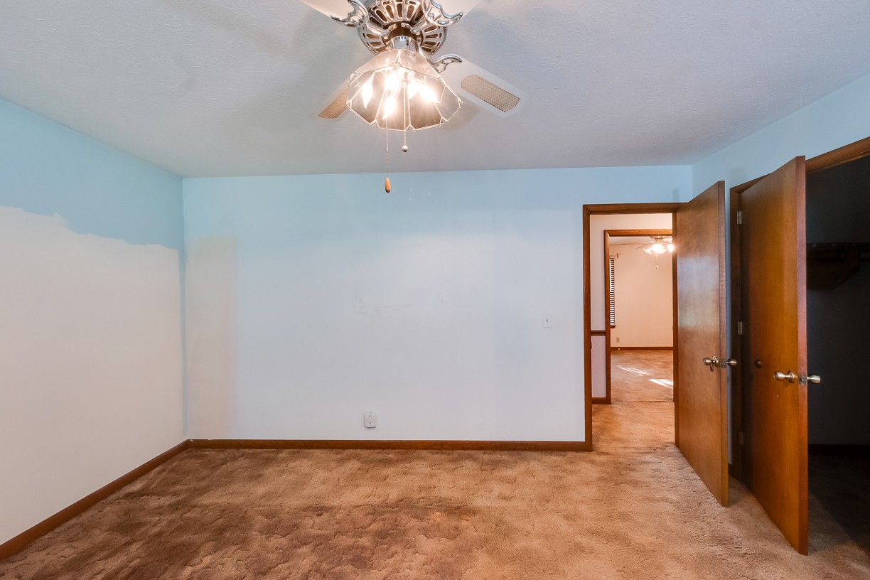 116 Green Acres Road Cottontown, TN 37048 - Photo 12 of 44 a view of an empty room with a chandelier fan