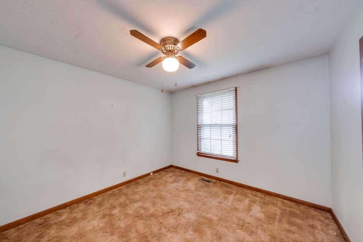 116 Green Acres Road Cottontown, TN 37048 - Photo 18 of 44 an empty room with windows and fan
