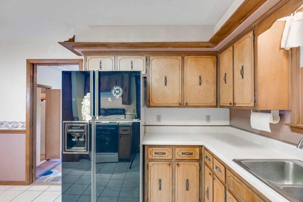 116 Green Acres Road Cottontown, TN 37048 - Photo 23 of 44 a kitchen with a sink cabinets and stainless steel appliances