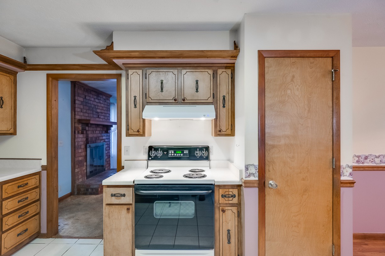 116 Green Acres Road Cottontown, TN 37048 - Photo 24 of 44 a kitchen with stainless steel appliances granite countertop a stove and a refrigerator