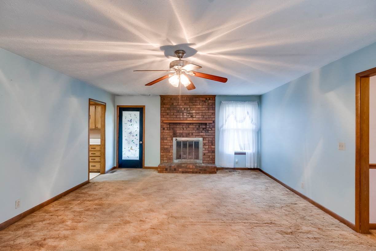 116 Green Acres Road Cottontown, TN 37048 - Photo 34 of 44 a view of a livingroom with a chandelier fan and windows
