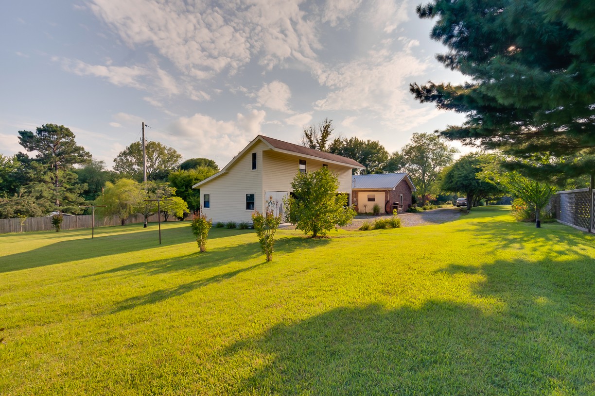 116 Green Acres Road Cottontown, TN 37048 - Photo 39 of 44 a swimming pool with yard and outdoor seating